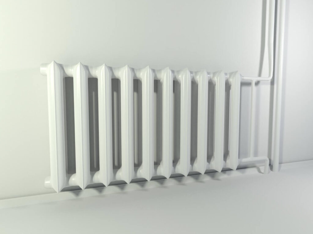 Tache de couleur sur un radiateur blanc, causée par un vêtement qui a déteint.